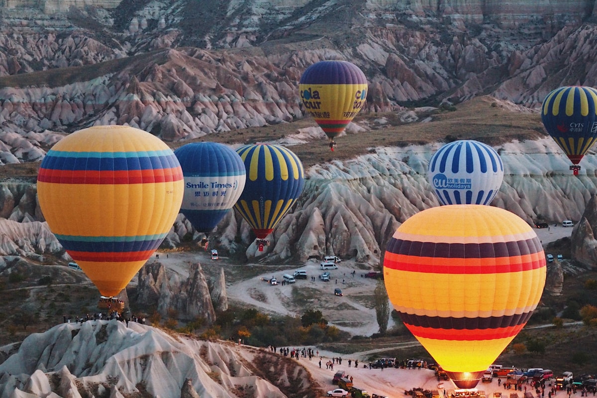 Hot air balloons flying over a valley in Cappadocia, Turkey