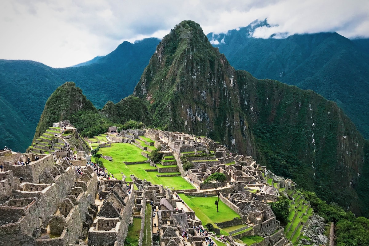 The green and brown mountains around Machu Picchu under a blue sky, Peru