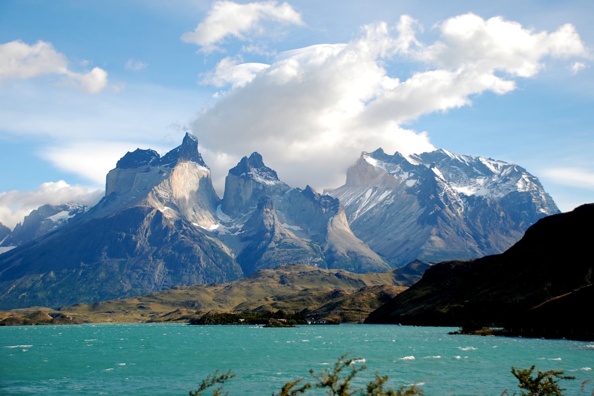 A body of water below the mountains of Patagonia